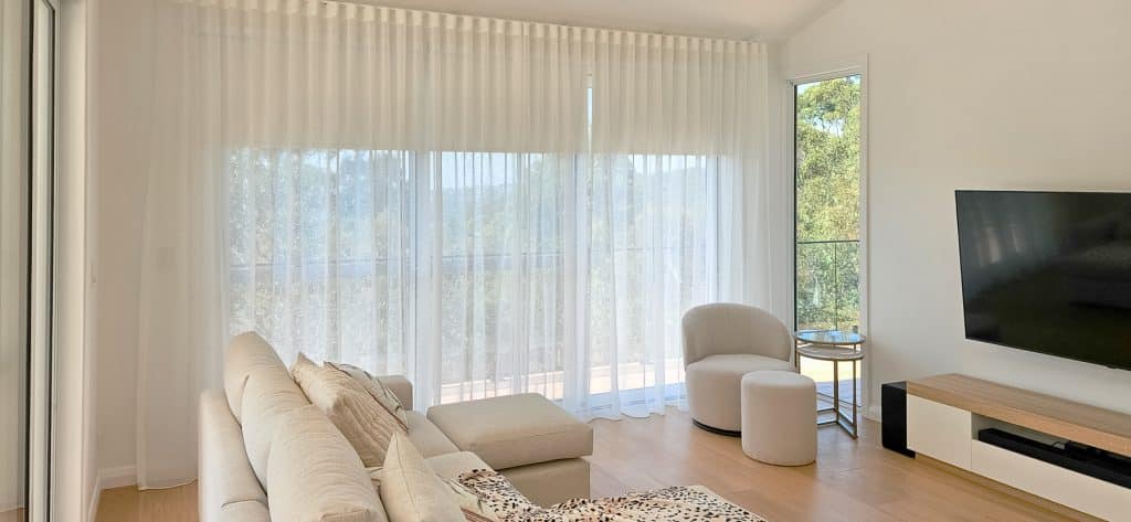 Sheer Curtains with Blockout Roller Blinds in Living Room Area