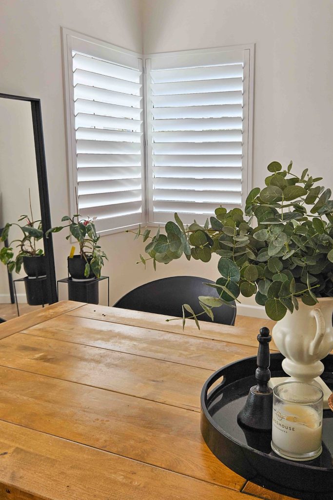 Shutters in Z-Frame into a corner of a dining room in Collaroy